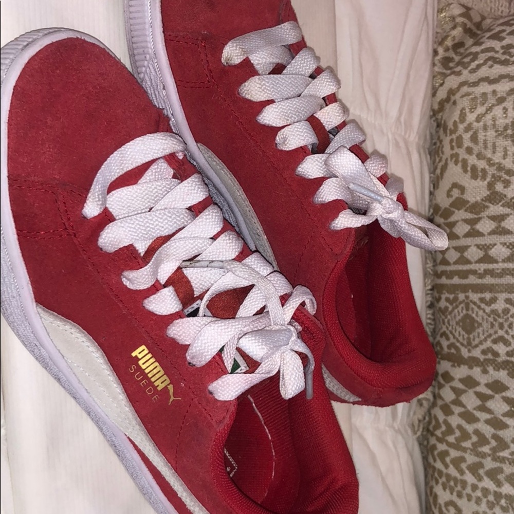 Red suede Pumas